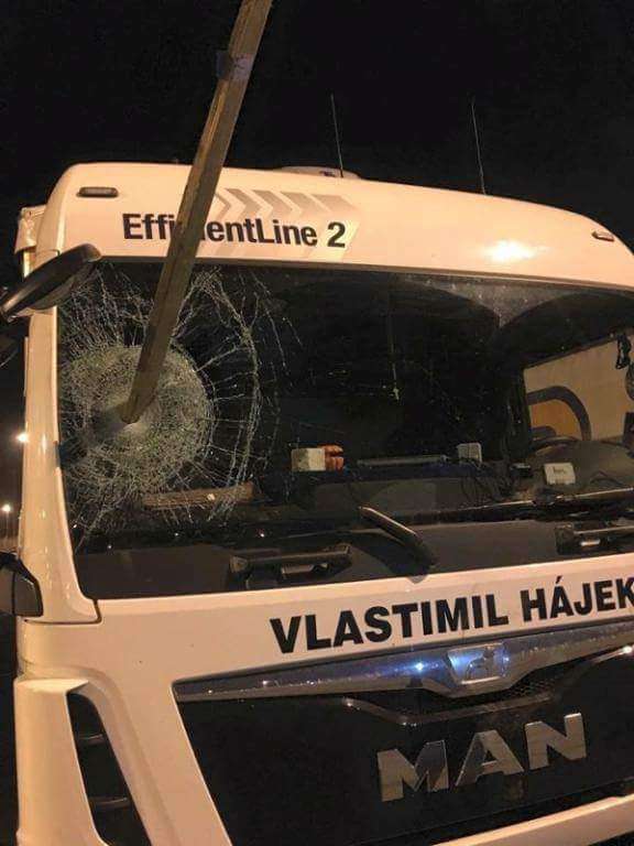 Damage to lorry post through windscreen